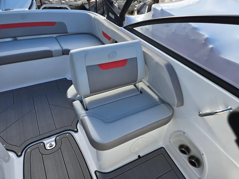 Slide: The Image of 2025 Hurricane SunDeck 235 OB boat interior with gray and red seating. - 12