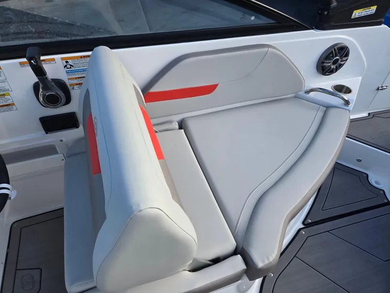 Slide: The Image of 2025 Hurricane SunDeck 235 OB boat interior with gray and red seating. - 20