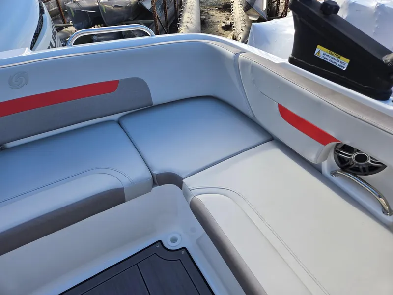 Slide: The Image of 2025 Hurricane SunDeck 235 OB boat interior with cushioned seating and modern design. - 22