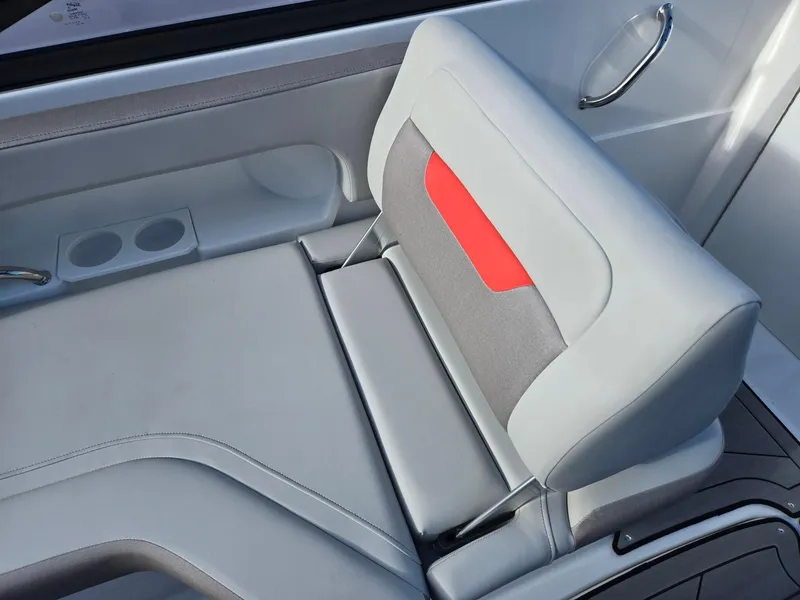 Slide: The Image of 2025 Hurricane SunDeck 235 OB boat seat with modern design and red accent. - 25