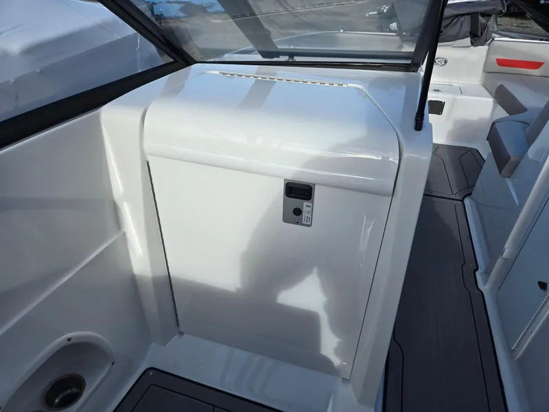 Slide: The Image of 2025 Hurricane SunDeck 235 OB interior, featuring sleek white cabinetry and modern design elements. - 26