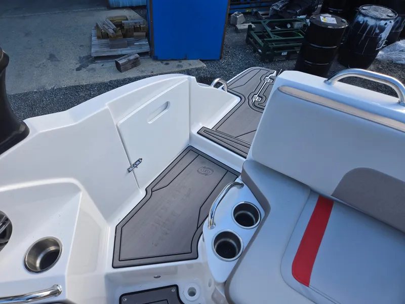 Slide: The Image of 2025 Hurricane SunDeck 235 OB boat interior with seating and cup holders. - 28