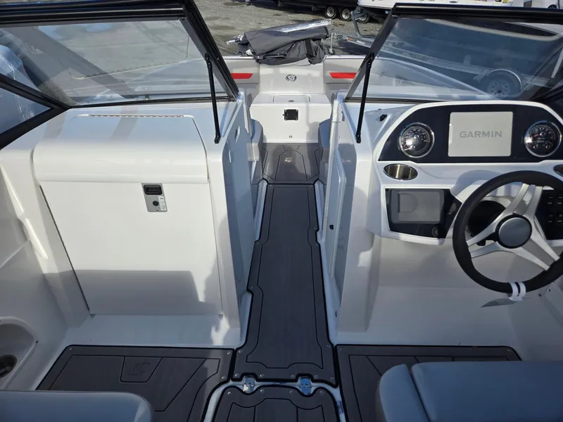 Slide: The Image of 2025 Hurricane SunDeck 235 OB boat interior with Garmin navigation system. - 35