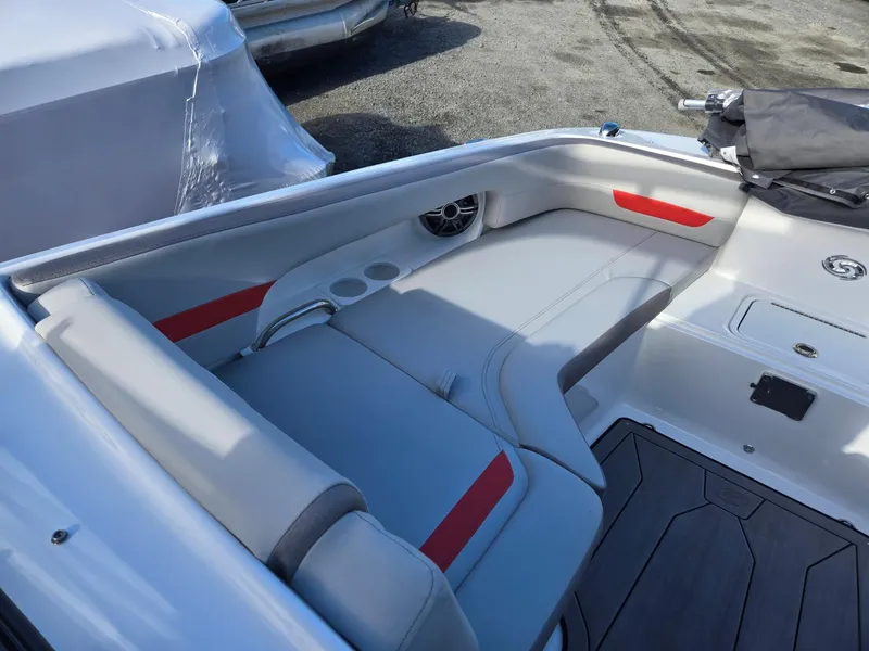 Slide: The Image of 2025 Hurricane SunDeck 235 OB boat interior with gray and red seating. - 39