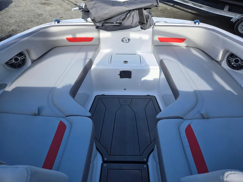 Slide: The Image of 2025 Hurricane SunDeck 235 OB boat interior with gray and red seating. - 40