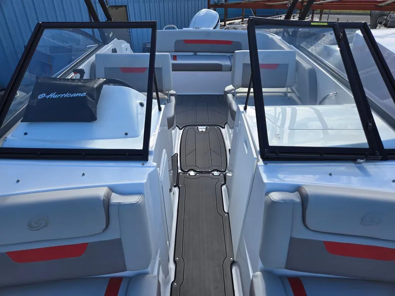 Slide: The Image of 2025 Hurricane SunDeck 235 OB boat interior with sleek seating and modern design. - 7