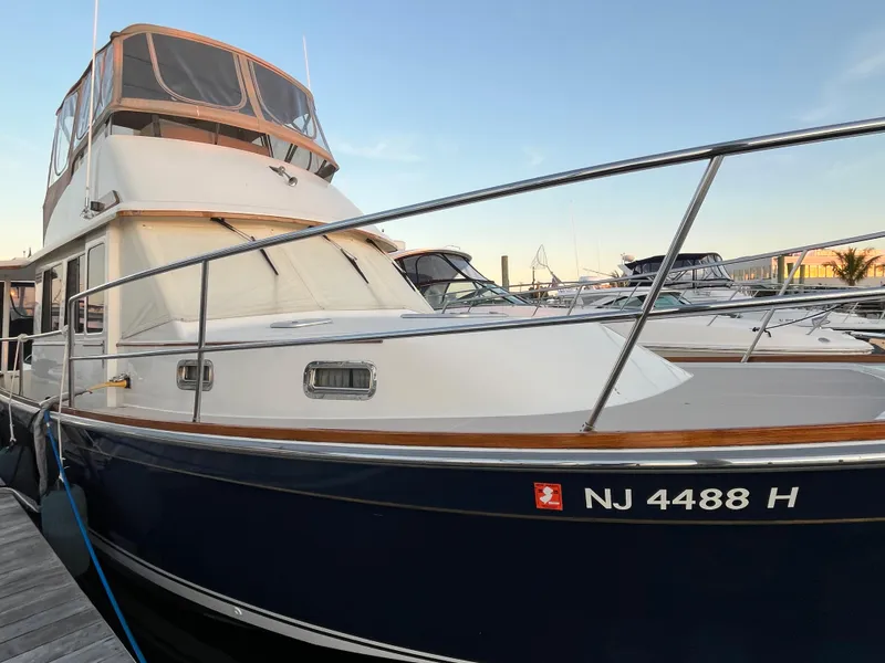 Slide: The Image of 2004 Sabre 36 Sedan boat docked, side view with registration NJ 4488 H. - 1