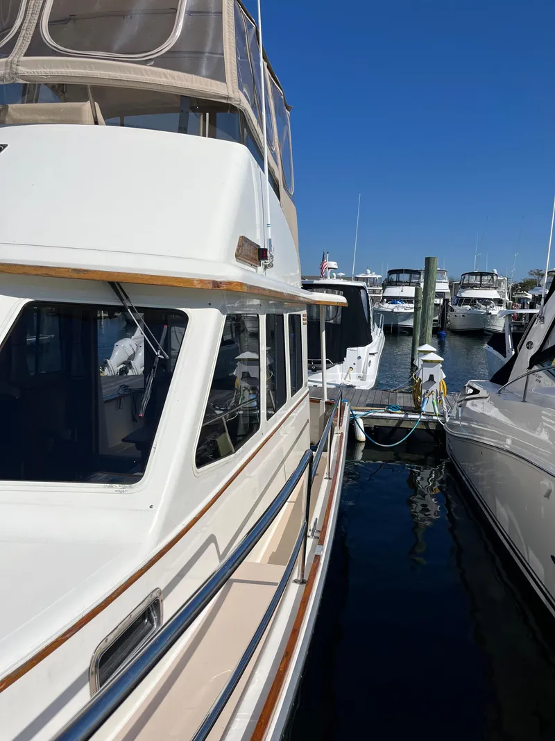 Slide: The Image of 2004 Sabre 36 Sedan yacht docked at marina under clear blue sky. - 11