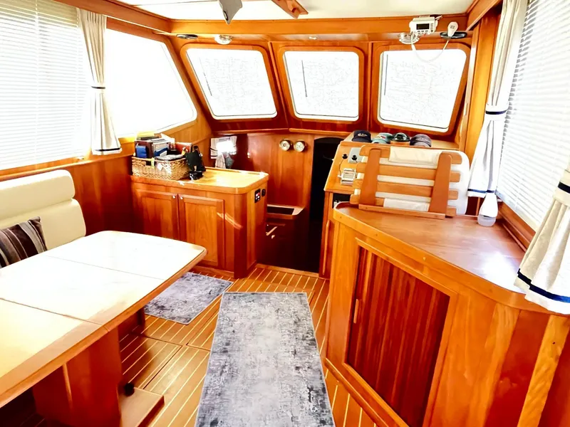 Slide: The Image of Interior of 2004 Sabre 36 Sedan yacht with wood finish and seating area. - 16