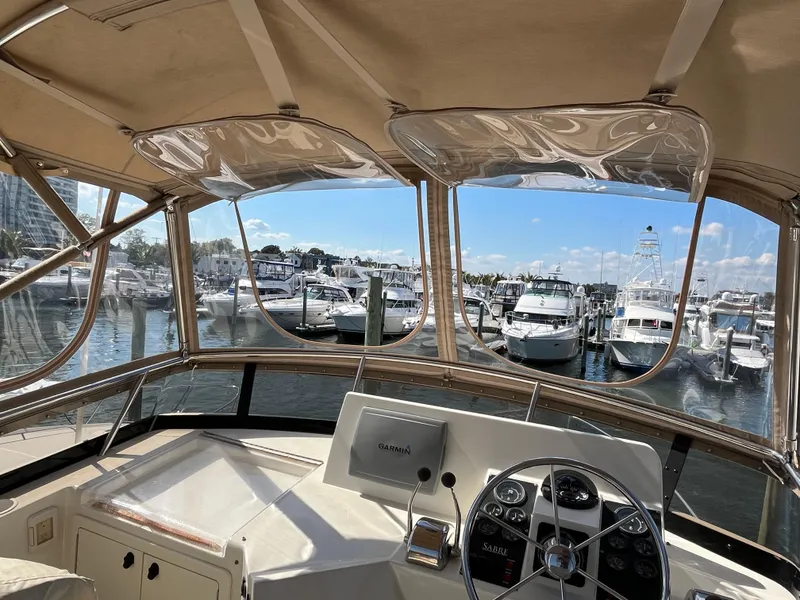 Slide: The Image of View from 2004 Sabre 36 Sedan helm overlooking marina with docked boats. - 34