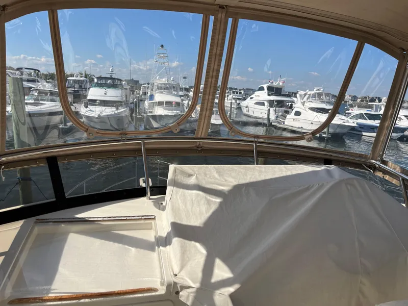 Slide: The Image of View from 2004 Sabre 36 Sedan yacht, overlooking marina with multiple boats. - 36