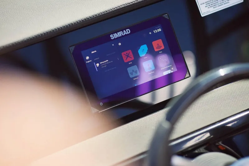 Slide: The Image of Simrad display on 2024 Sea Ray 210SPX boat dashboard. - 13