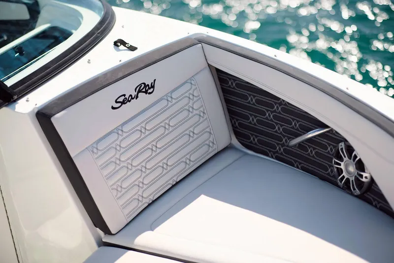 Slide: The Image of 2024 Sea Ray 210SPX boat interior with stylish seating and speaker detail. - 17