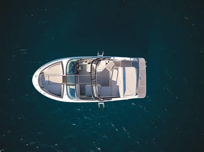 Slide: The Image of Aerial view of 2024 Sea Ray 210SPX boat on clear blue water. - 4