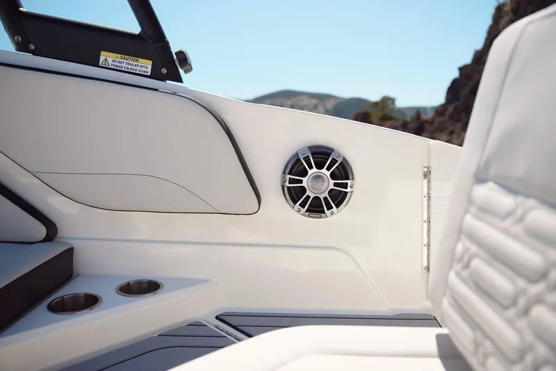 Slide: The Image of 2024 Sea Ray 210SPX boat interior with speaker and cup holders. - 6