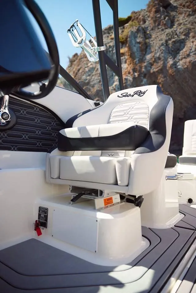 Slide: The Image of 2024 Sea Ray 210SPX boat interior with captain's seat and modern design. - 9
