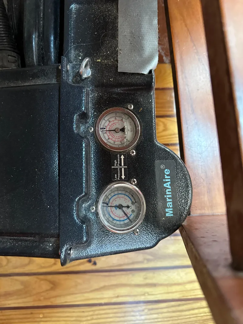 Slide: The Image of Vintage 1978 Rival 41C appliance with MarinAire gauges on wooden floor. - 12