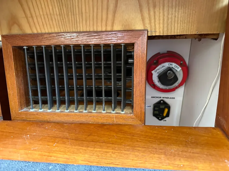 Slide: The Image of 1978 Rival 41C boat interior with vent and anchor windlass control. - 13