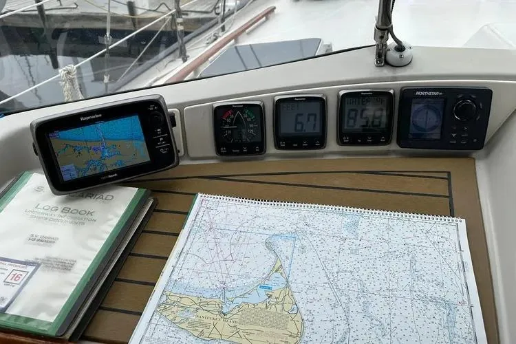 Slide: The Image of Navigation equipment and map on 1978 Rival 41C yacht dashboard. - 24