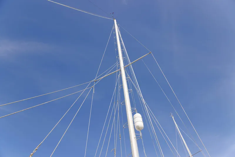 Slide: The Image of Mast of 1978 Rival 41C sailboat against clear blue sky. - 35
