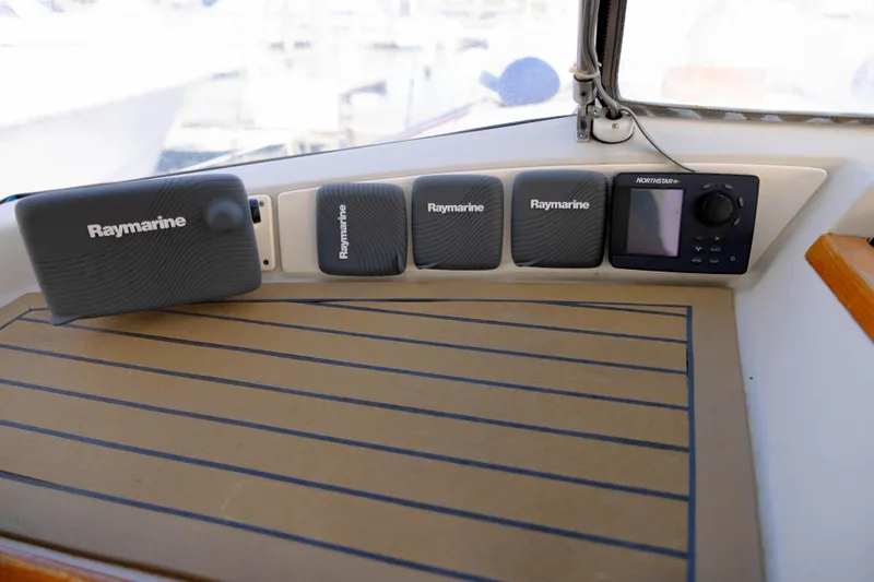 Slide: The Image of Raymarine navigation equipment on 1978 Rival 41C boat dashboard. - 39