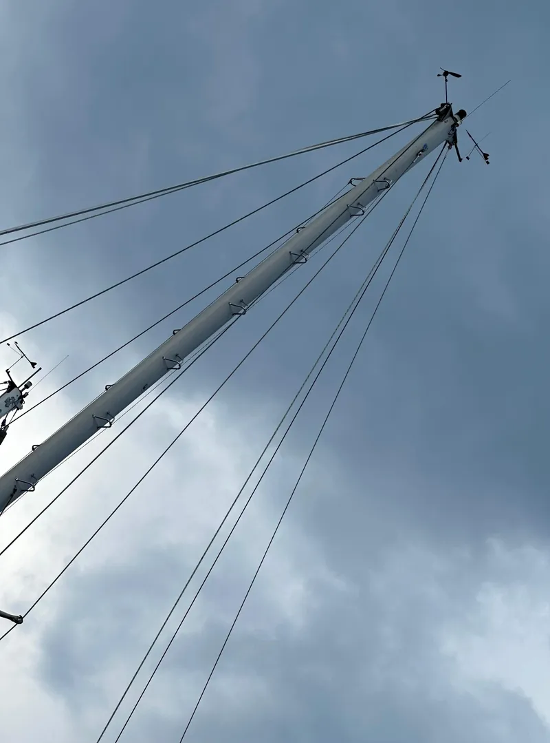 Slide: The Image of Sailboat mast against cloudy sky, Rival 41C, 1978 model. - 4