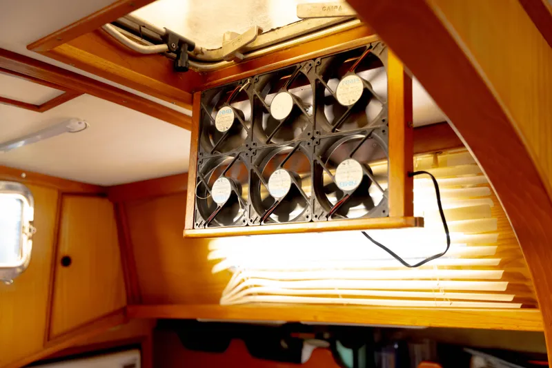 Slide: The Image of Ceiling fan setup inside a 1978 Rival 41C boat cabin. - 46
