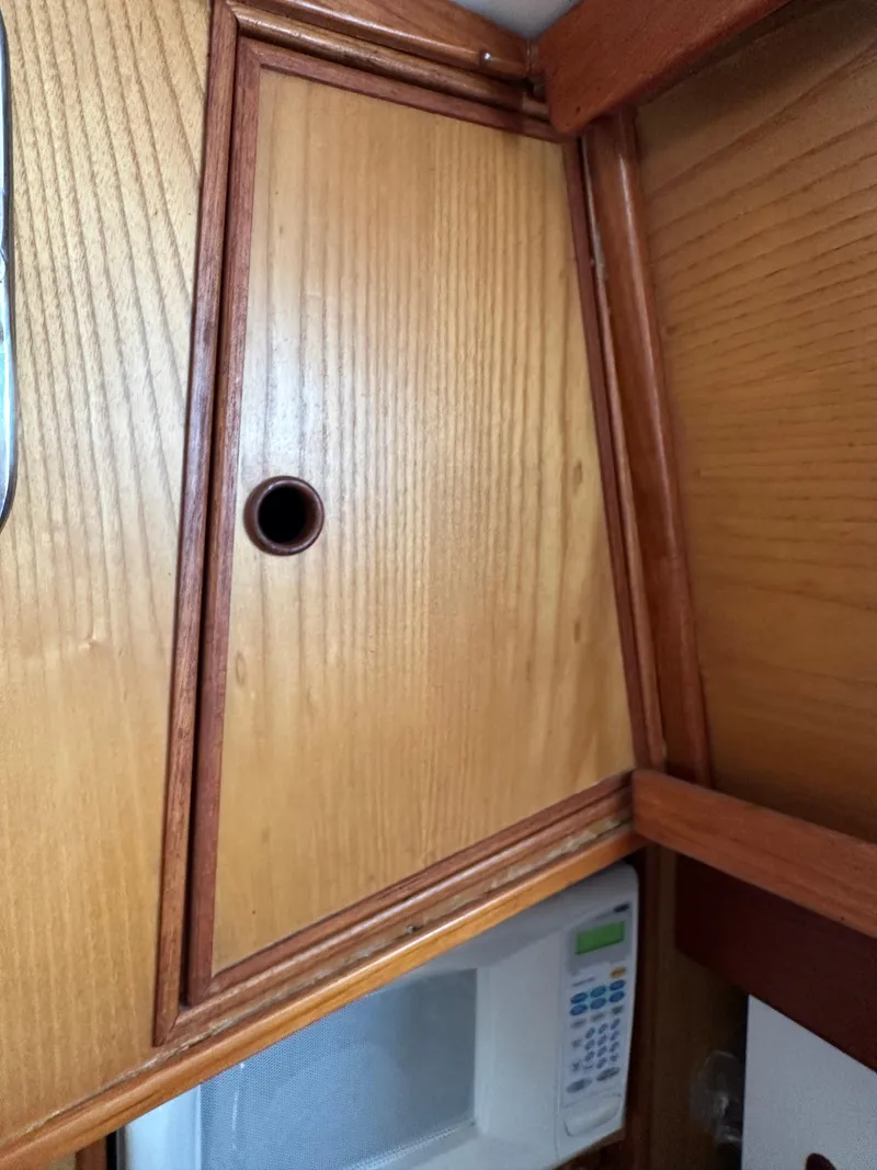 Slide: The Image of Wooden cabinet with circular handle above a microwave, Rival 41C, 1978 model. - 8