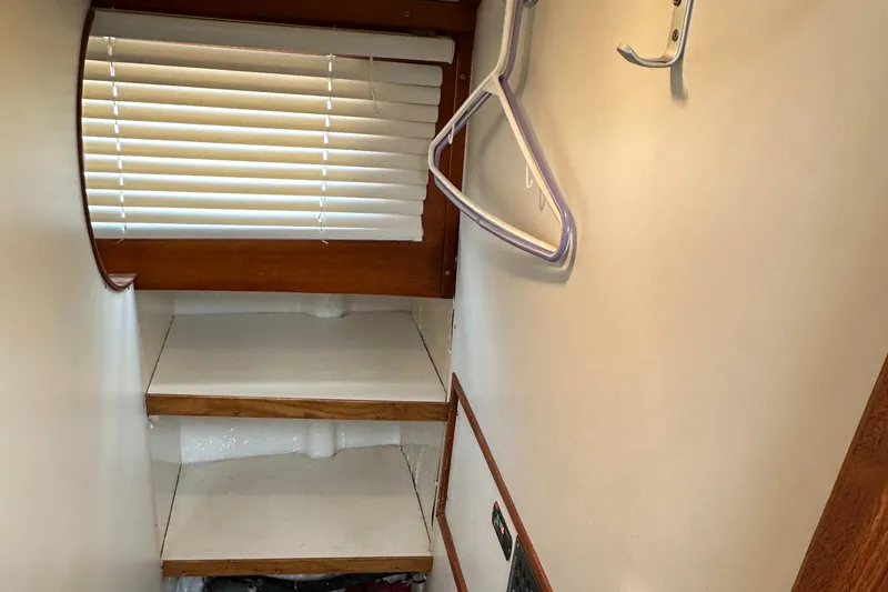 Slide: The Image of Interior of 1978 Rival 41C boat with shelves and window blinds. - 9