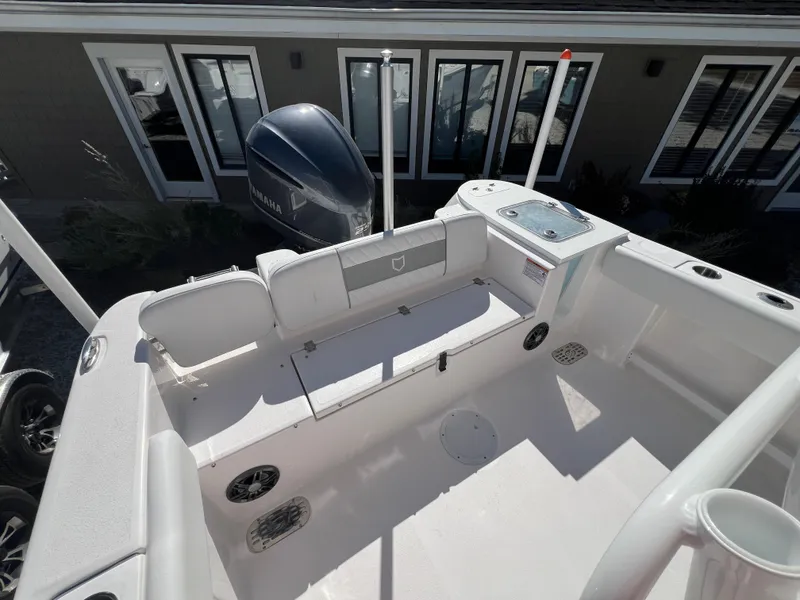 Slide: The Image of 2025 Sea Fox 248 Commander boat interior with seating and Yamaha engine. - 10