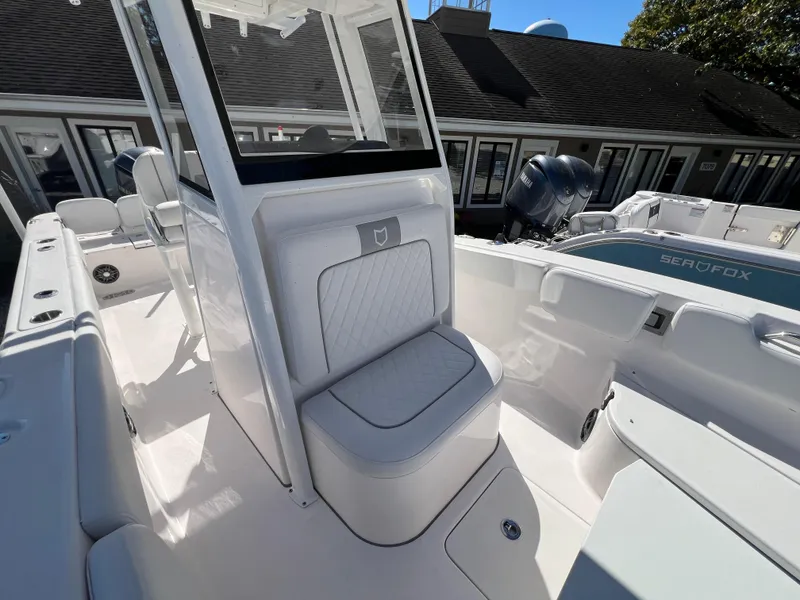 Slide: The Image of 2025 Sea Fox 248 Commander boat interior with seating and console. - 6