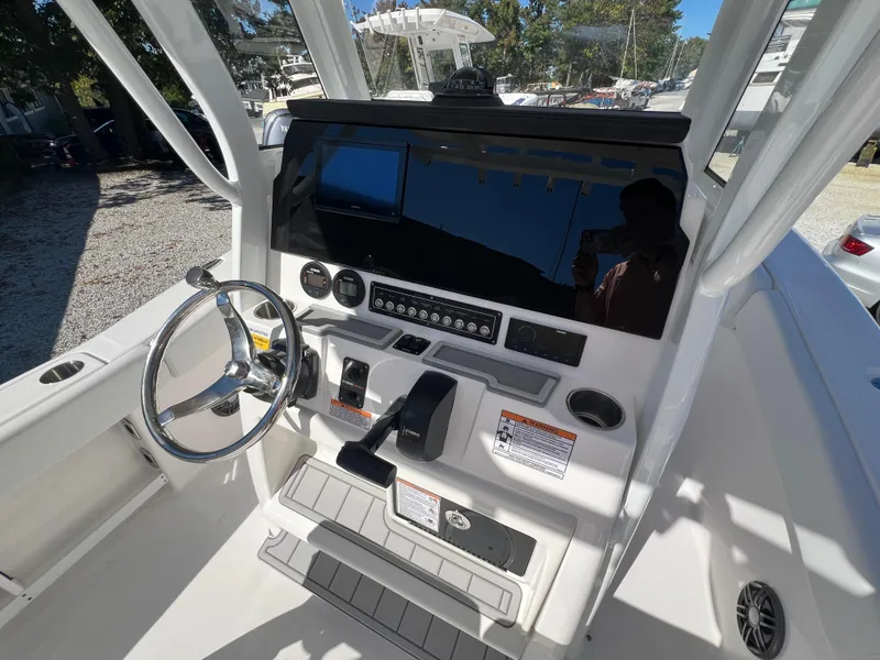 Slide: The Image of 2025 Sea Fox 248 Commander boat dashboard with steering wheel and controls. - 8