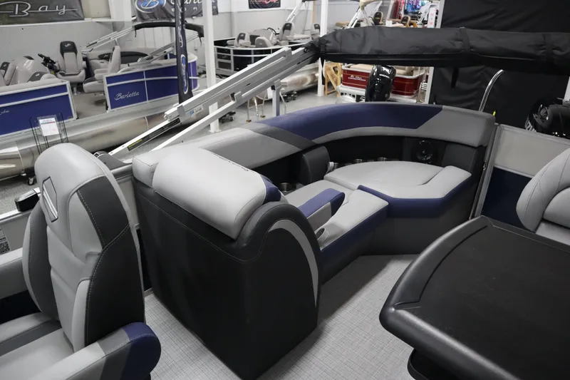 Slide: The Image of Interior of 2025 South Bay 222E pontoon boat with modern seating and sleek design. - 13