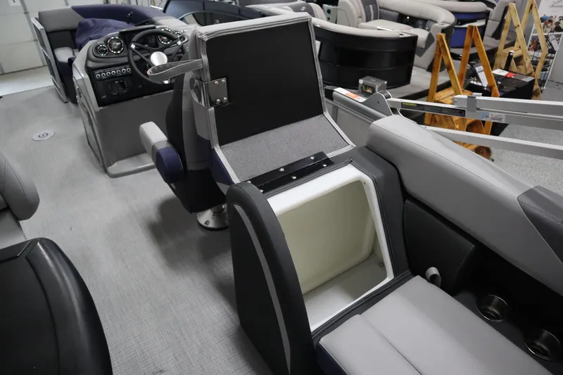 Slide: The Image of Interior of 2025 South Bay 222E pontoon boat with seating and storage compartments. - 15