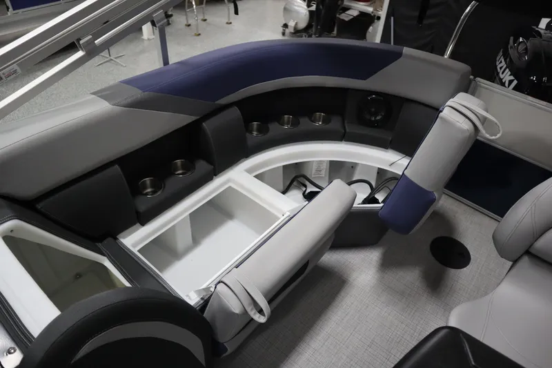 Slide: The Image of Interior of 2025 South Bay 222E boat with seating and storage compartments. - 16