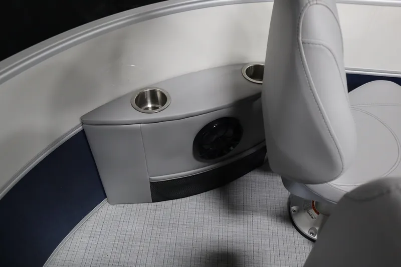 Slide: The Image of Interior of 2025 South Bay 222E boat with cup holders and speaker. - 17