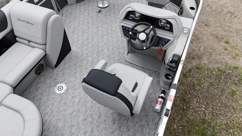 Slide: The Image of 2025 South Bay 220 F boat interior with steering console and seating. - 11