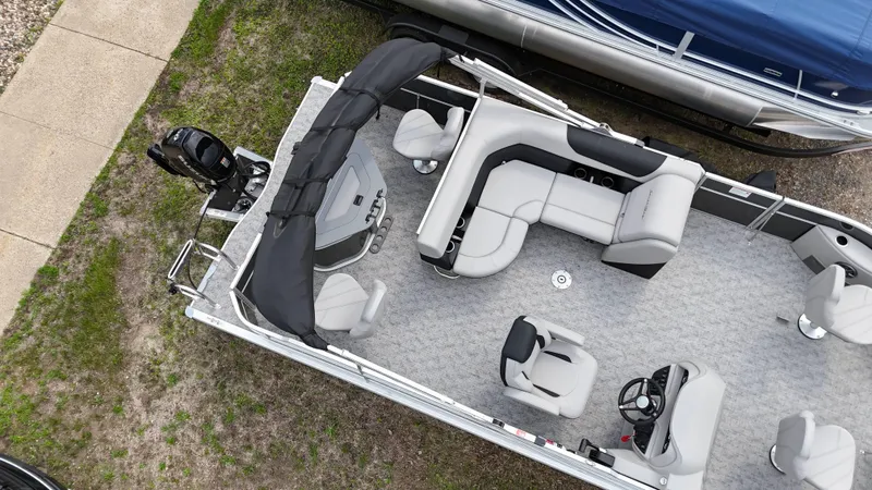 Slide: The Image of 2025 South Bay 220 F pontoon boat, aerial view, showcasing seating and helm layout. - 13