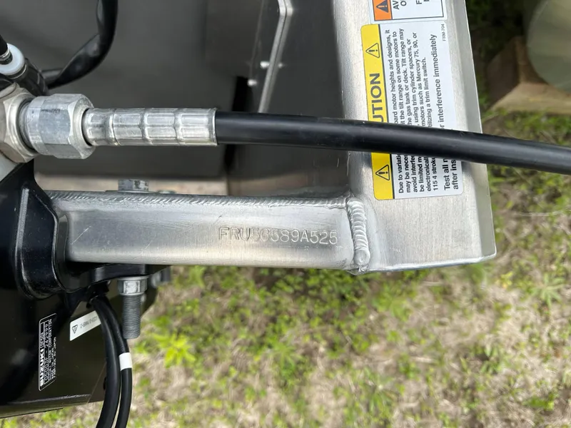 Slide: The Image of 2025 South Bay 220 F boat component with serial number and caution labels. - 19