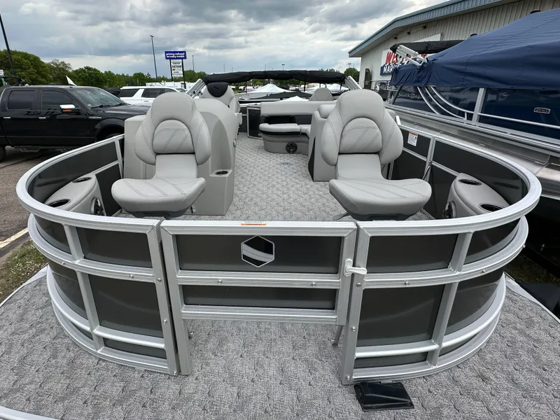 Slide: The Image of 2025 South Bay 220 F pontoon boat with gray seating and modern design. - 8