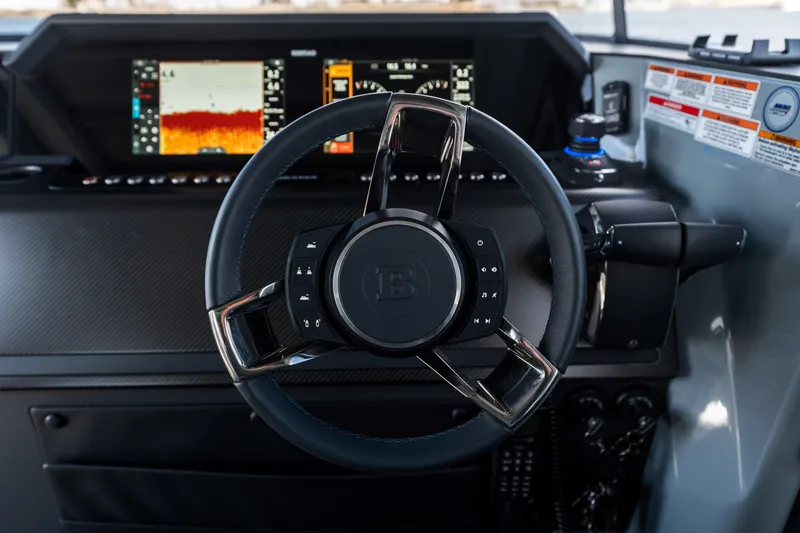 Slide: The Image of Steering wheel of 2025 BRABUS 1000 Cross Cabin Signature Edition with advanced dashboard display. - 21