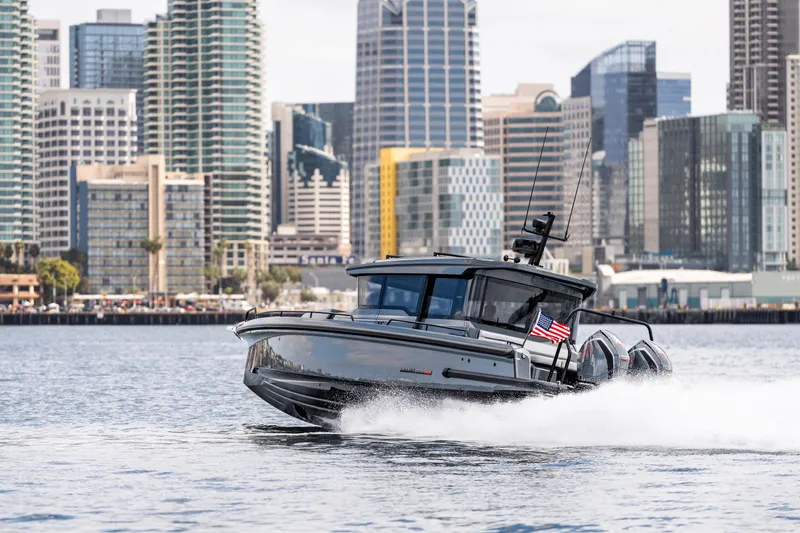 Slide: The Image of 2025 BRABUS 1000 Cross Cabin Signature Edition cruising in urban waterfront setting. - 3