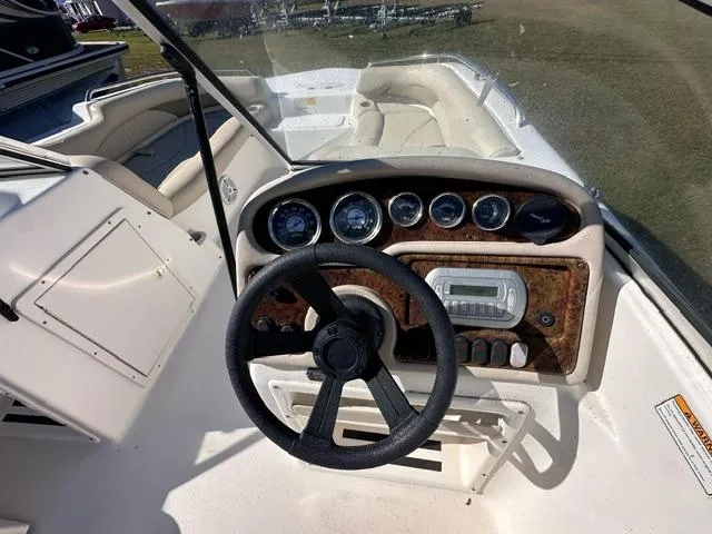 Slide: The Image of 2008 NauticStar 205DC Sport Deck boat dashboard with steering wheel and instrument panel. - 5