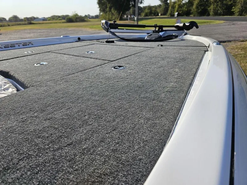 Slide: The Image of 2025 Skeeter ZX150 boat deck with carpeted surface and mounted equipment. - 14