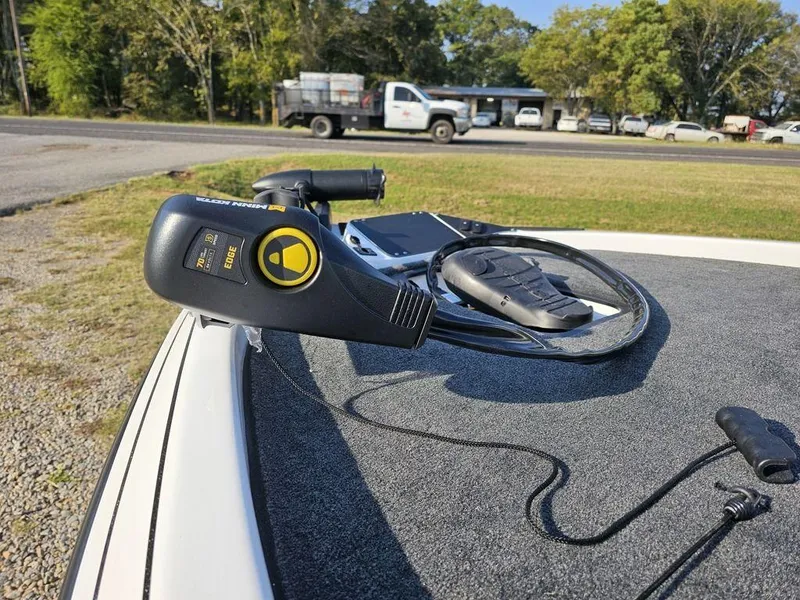 Slide: The Image of 2025 Skeeter ZX150 boat deck with trolling motor and control cables. - 2