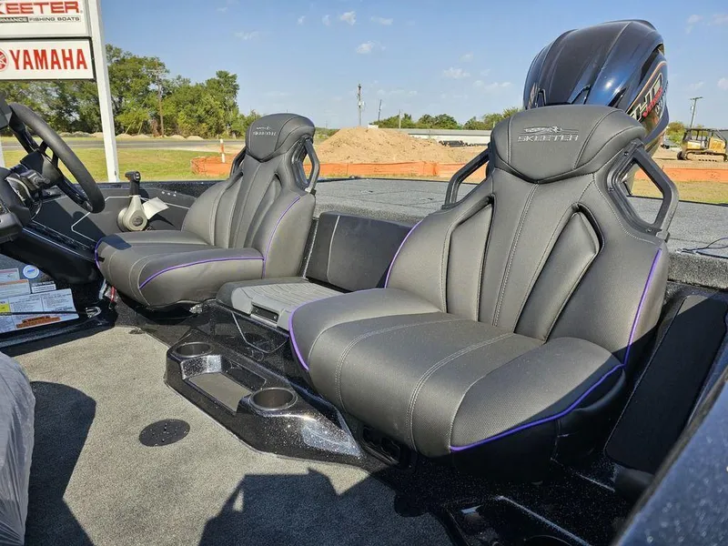 Slide: The Image of 2025 Skeeter ZXR19 boat interior with sleek, modern seats and Yamaha engine in background. - 6