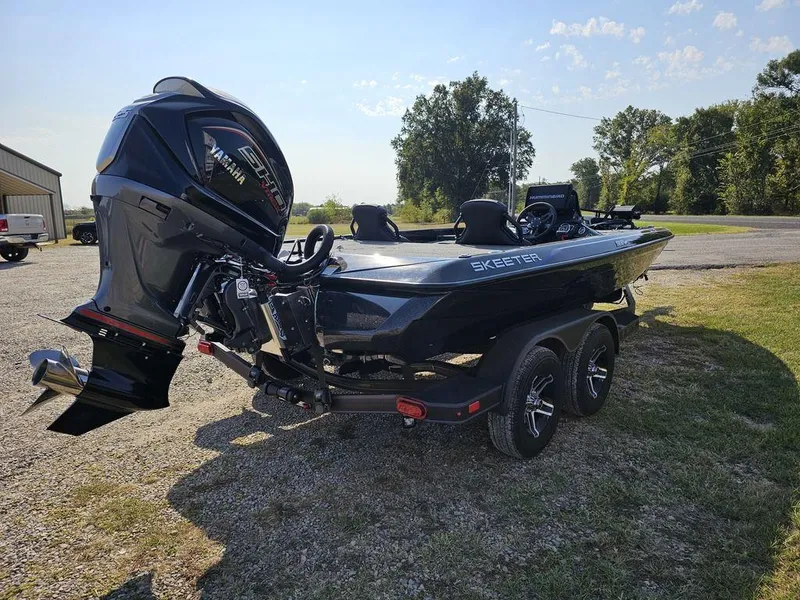 Slide: The Image of 2025 Skeeter ZXR19 boat with powerful outboard motor on a trailer. - 8