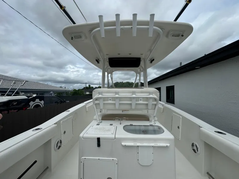 Slide: The Image of 2011 Sea Hunt Gamefish 29 boat interior with T-top and fishing amenities. - 12