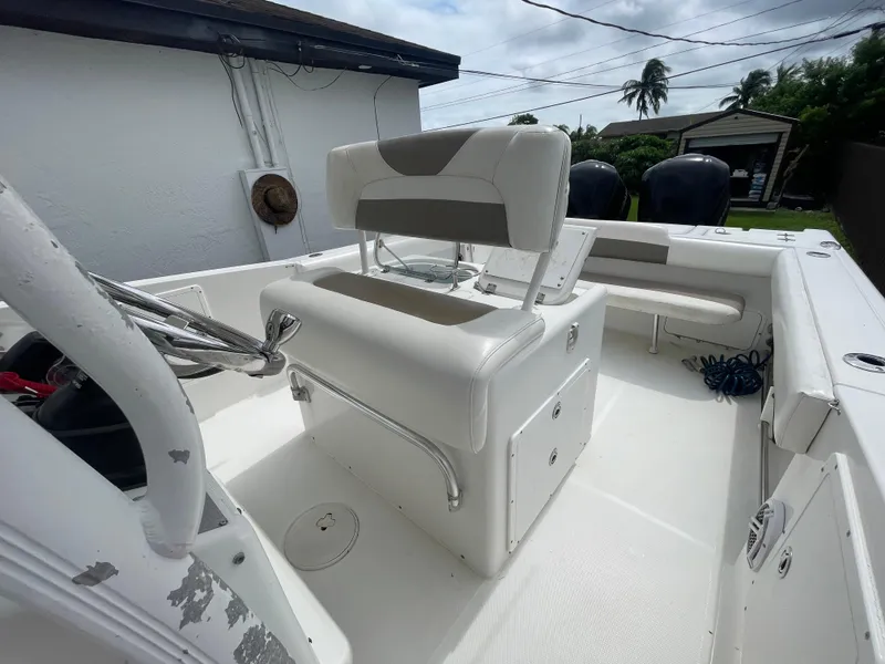 Slide: The Image of 2011 Sea Hunt Gamefish 29 boat interior with seating and console. - 15