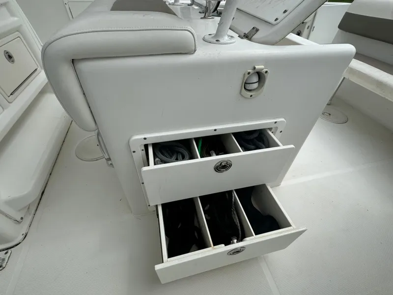 Slide: The Image of 2011 Sea Hunt Gamefish 29 boat storage drawers with fishing gear. - 16
